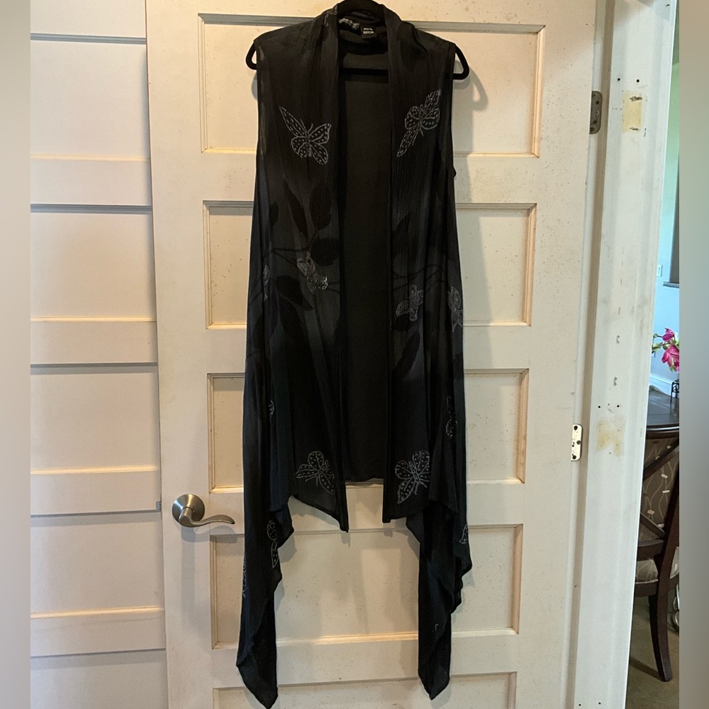 Black batik high low sleeveless duster with butterflies and leaves. One size.